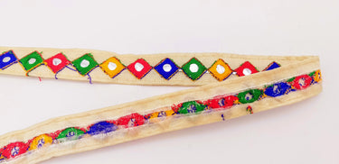 Wholesale Beige Cotton Fabric Mirrored Trim With Embroidery In Yellow, Blue, Red & Green Threads